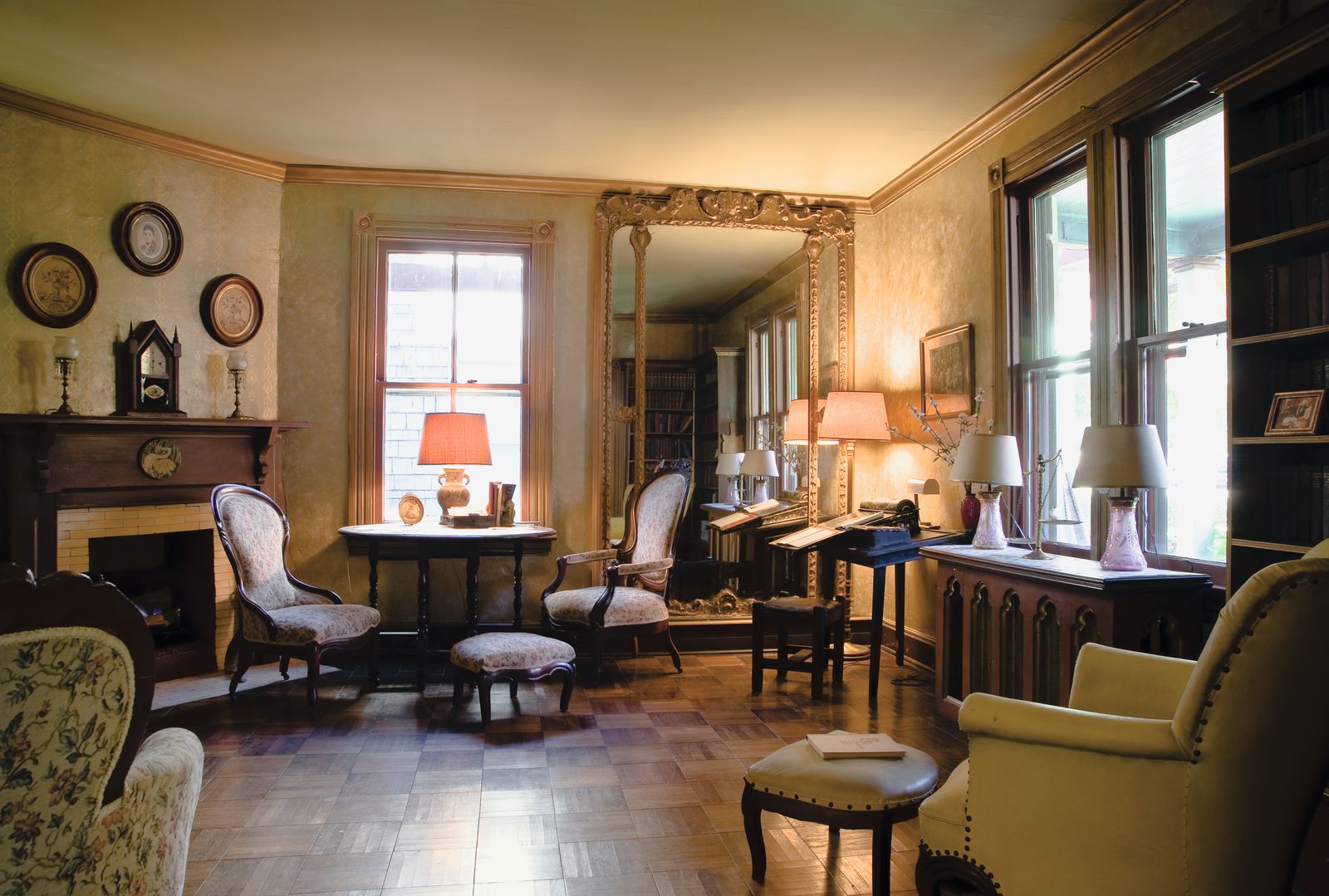Image may contain Lamp Architecture Building Furniture Indoors Living Room Room Chair Book and Publication