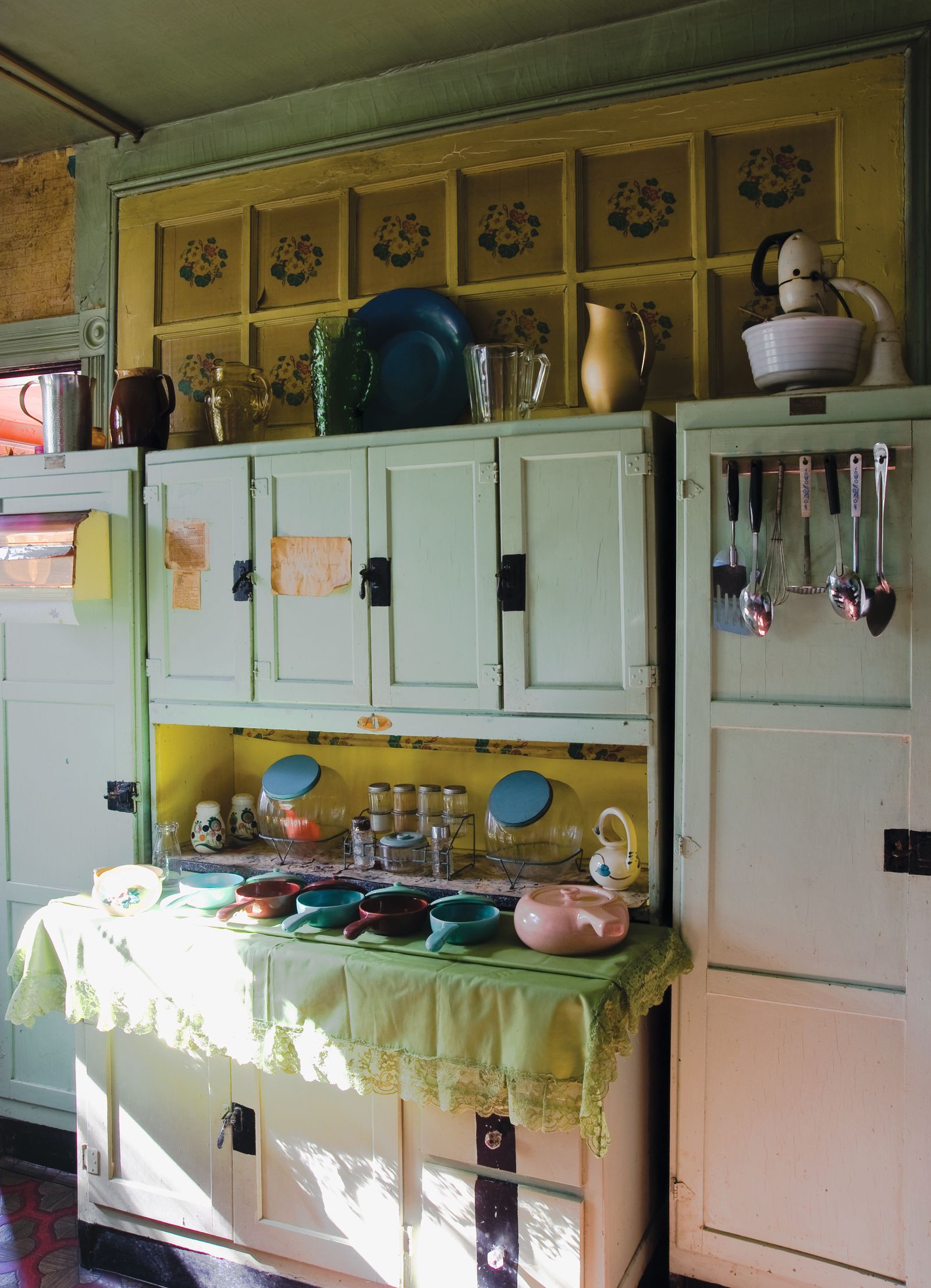 Image may contain Closet Cupboard Furniture Indoors Interior Design Kitchen Desk Table Sink and Sink Faucet