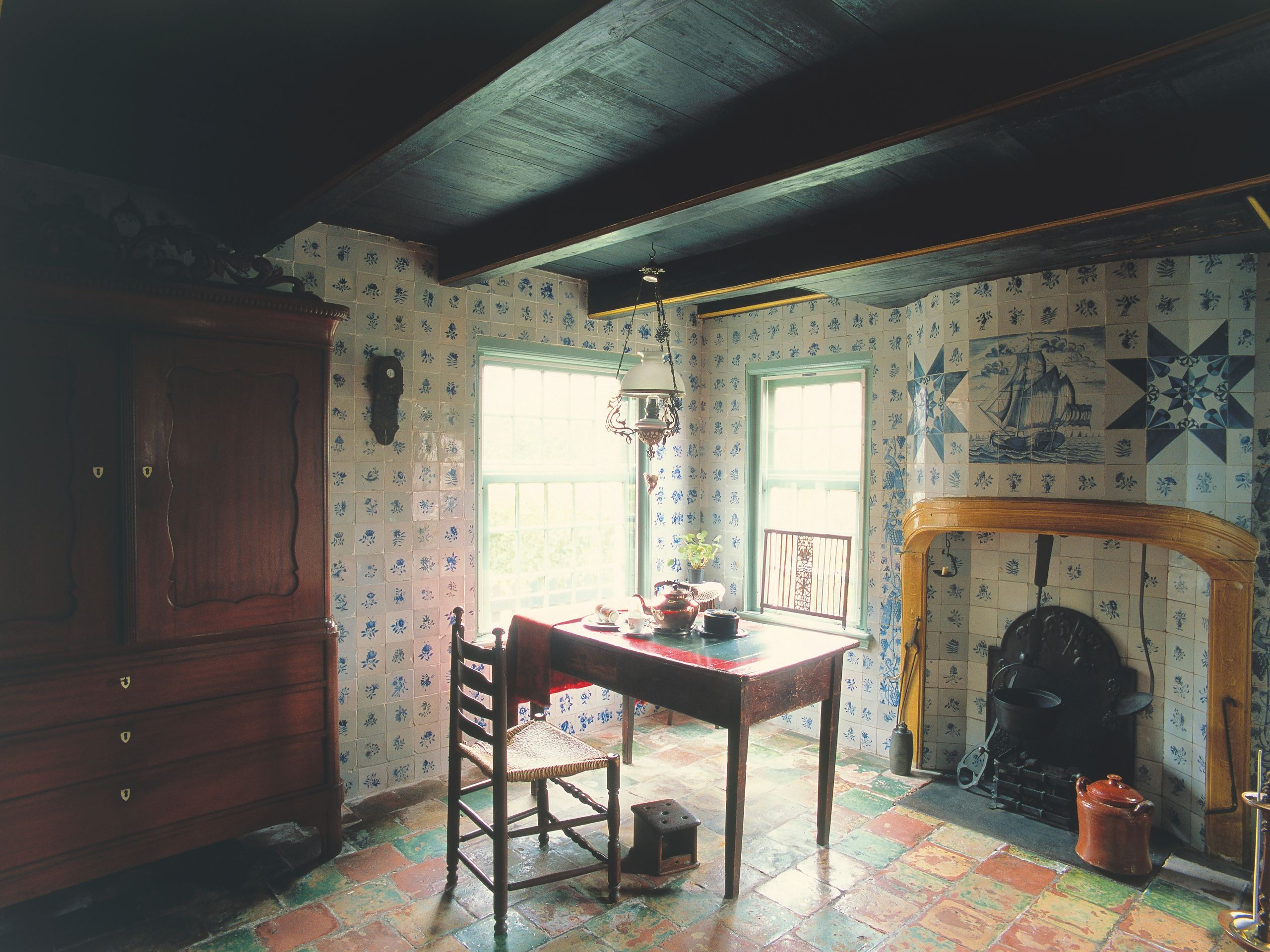 Image may contain Fireplace Indoors Chair Furniture Desk Table Interior Design Dining Table and Architecture