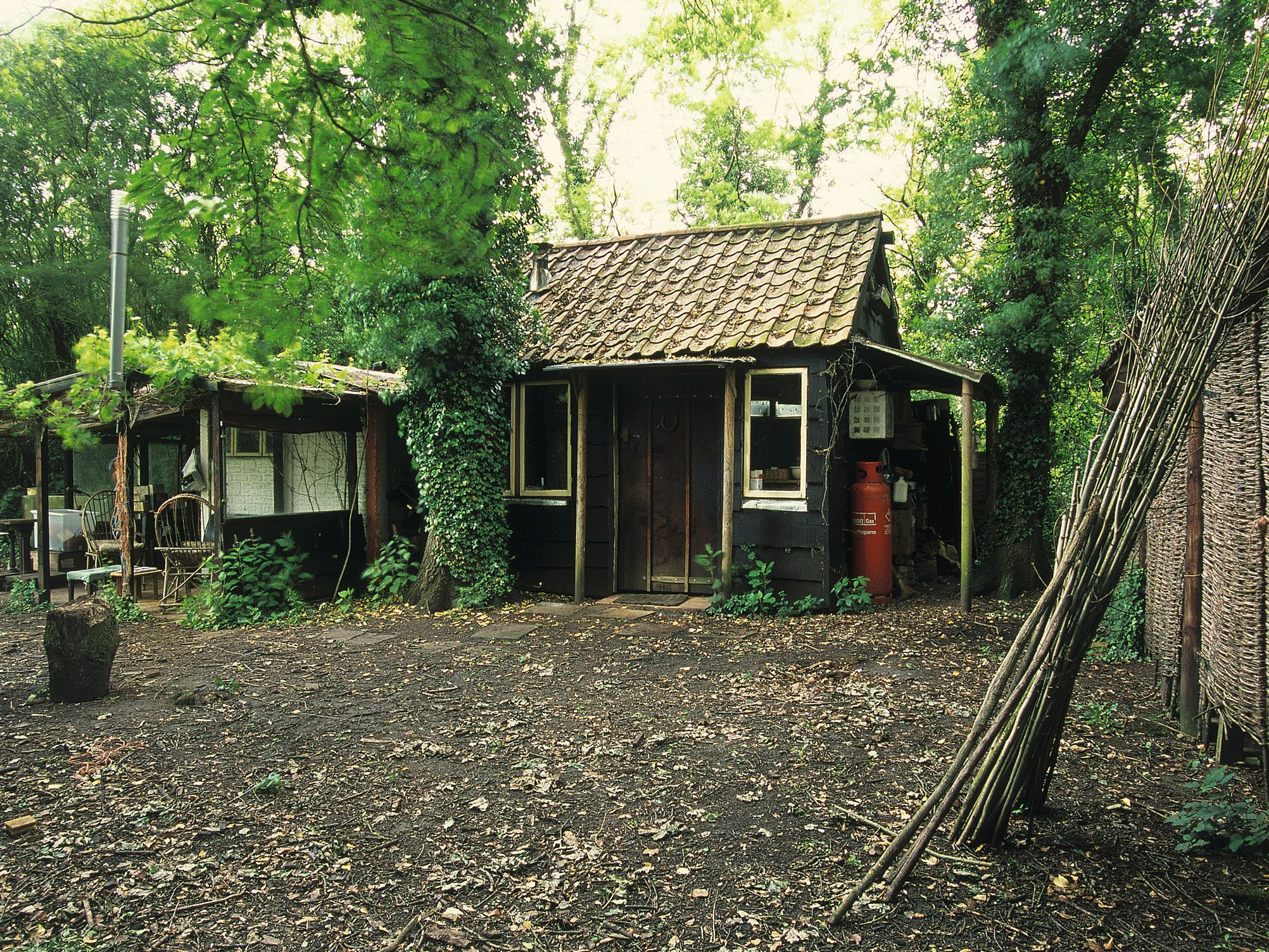 Image may contain Architecture Building Countryside Hut Nature Outdoors Rural Chair Furniture Housing and Bench