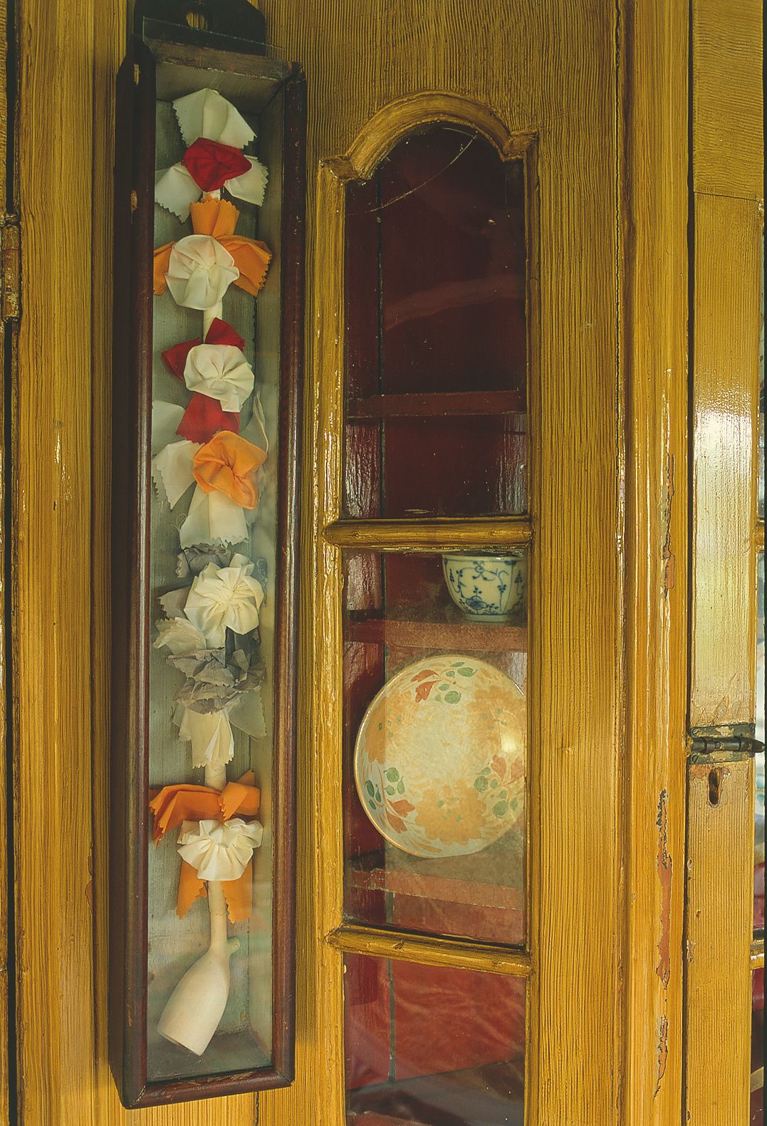 Image may contain Closet Cupboard Furniture Cabinet Flower Plant and Art