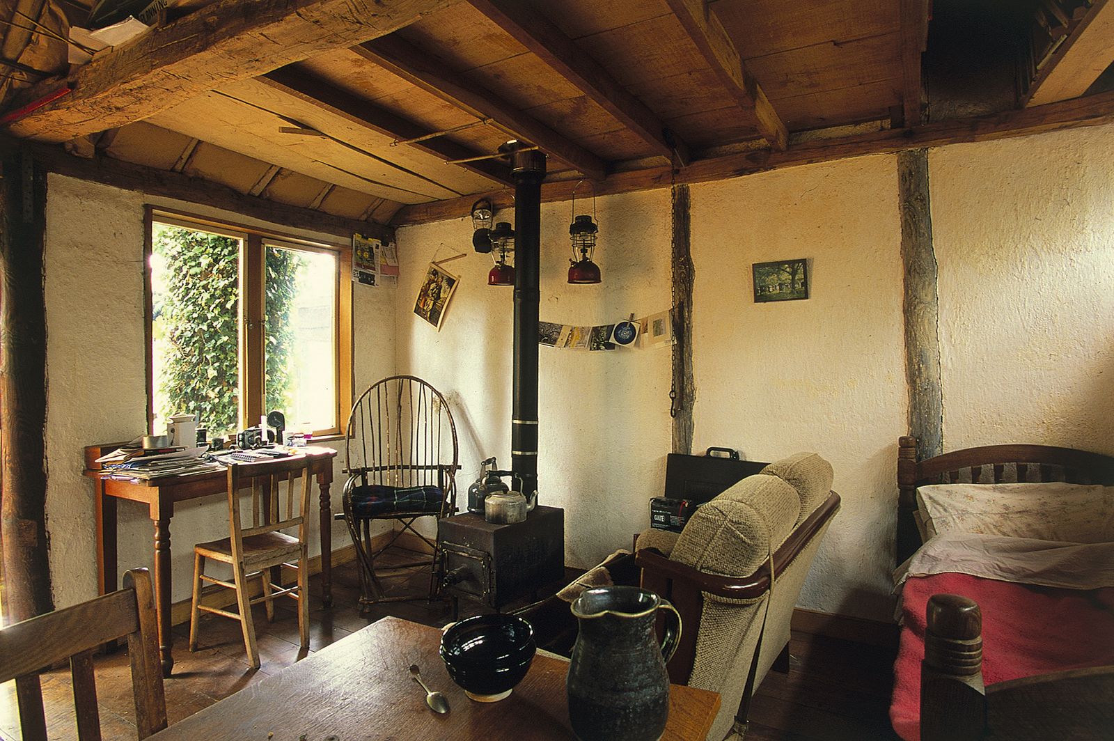 Image may contain Chair Furniture Desk Table Bed Wood Cutlery Spoon Architecture Building Indoors and Living Room