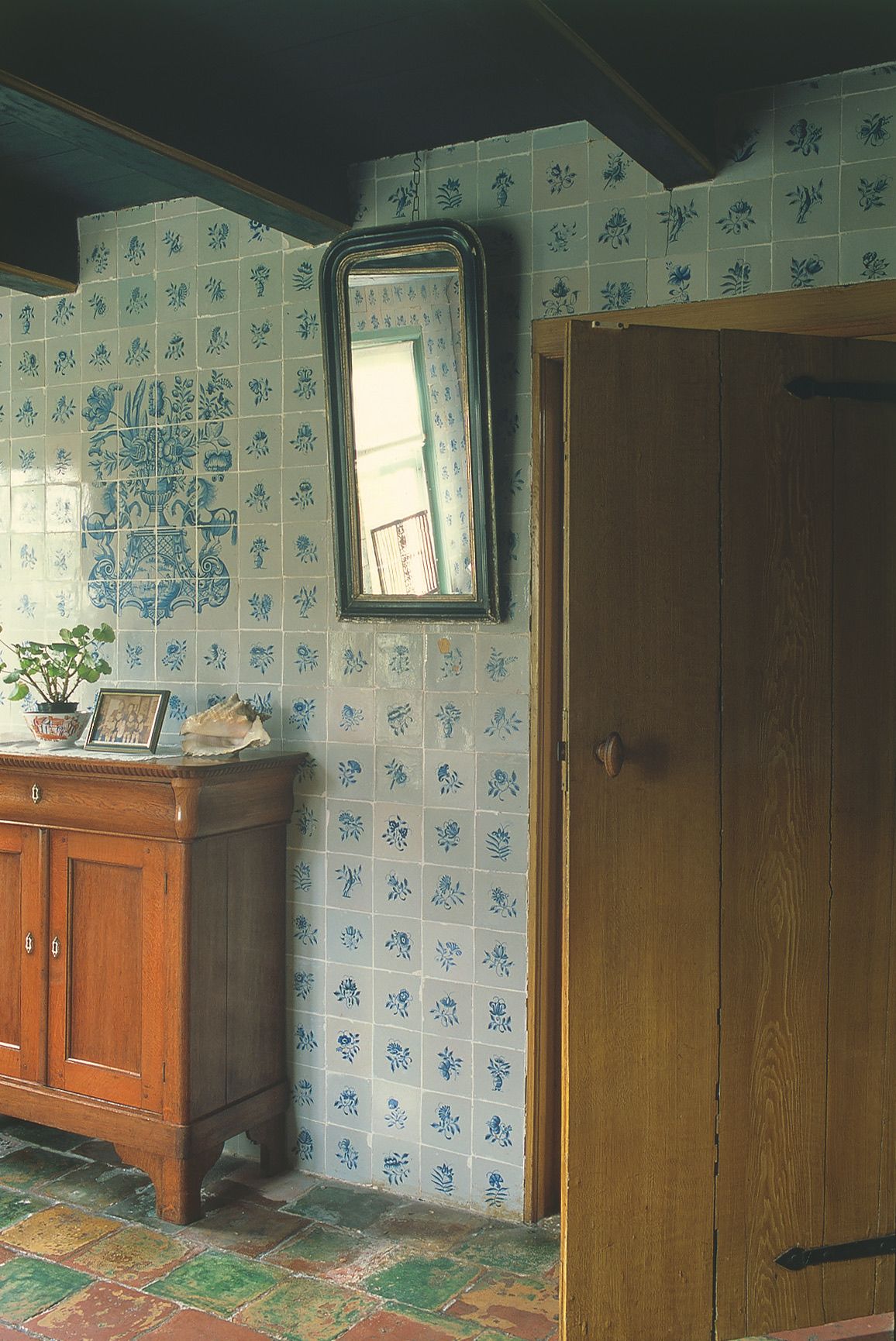 Image may contain Indoors Interior Design Corner Plant Wood Art Painting Floor Cabinet Furniture and Closet