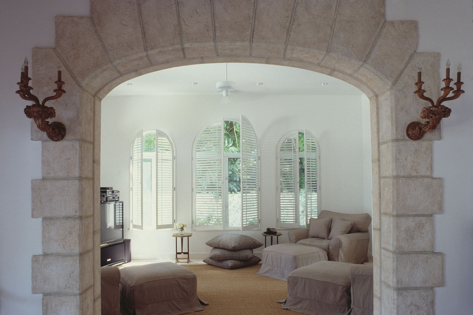 Image may contain Window Home Decor Arch Architecture Couch and Furniture
