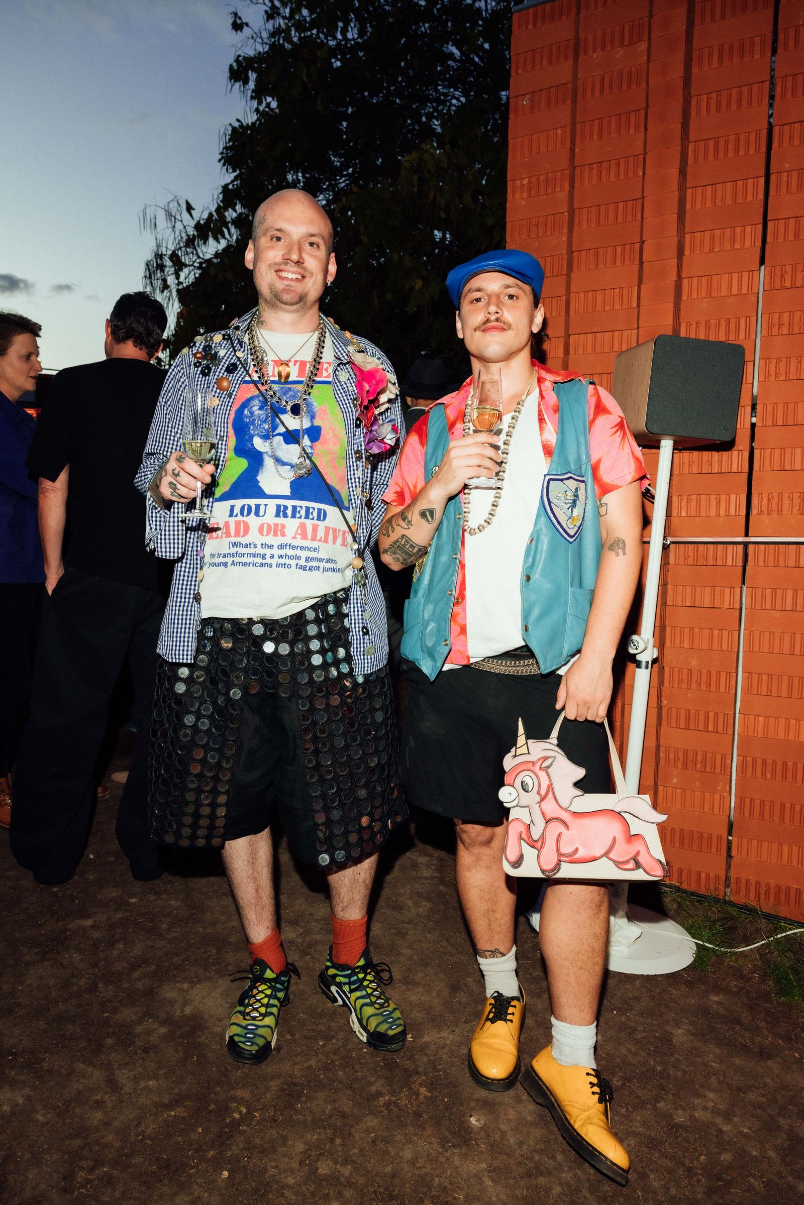 Image may contain Clothing Shorts Face Head Person Photography Portrait Skirt Footwear Shoe TShirt and Pants