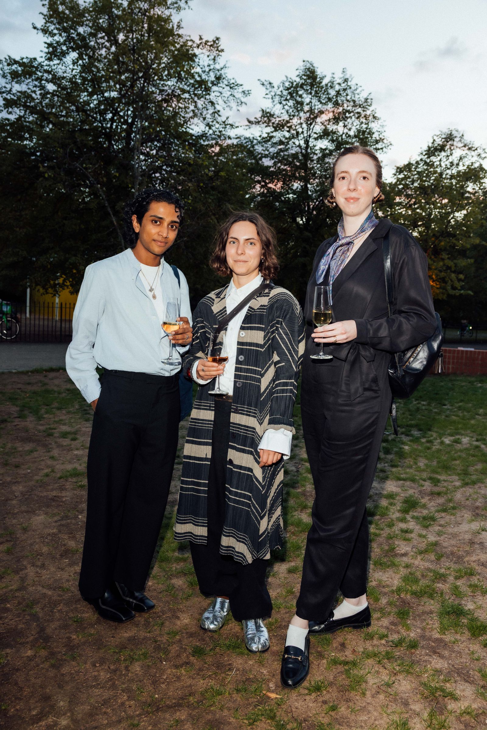 Image may contain Jodie Comer Blazer Clothing Coat Jacket Pants Formal Wear Suit Adult Person Blouse and Grass